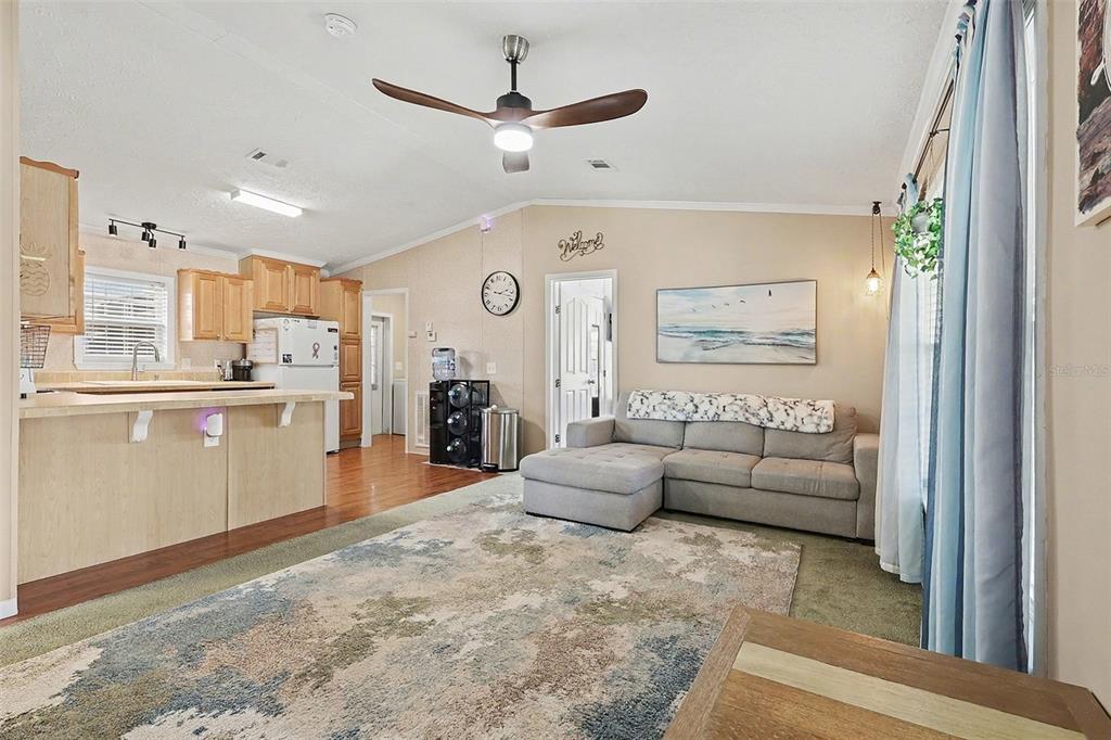 11305 Pineapple Road Punta Gorda, FL 33955 - Photo 6 of 30 a living room with furniture and kitchen view