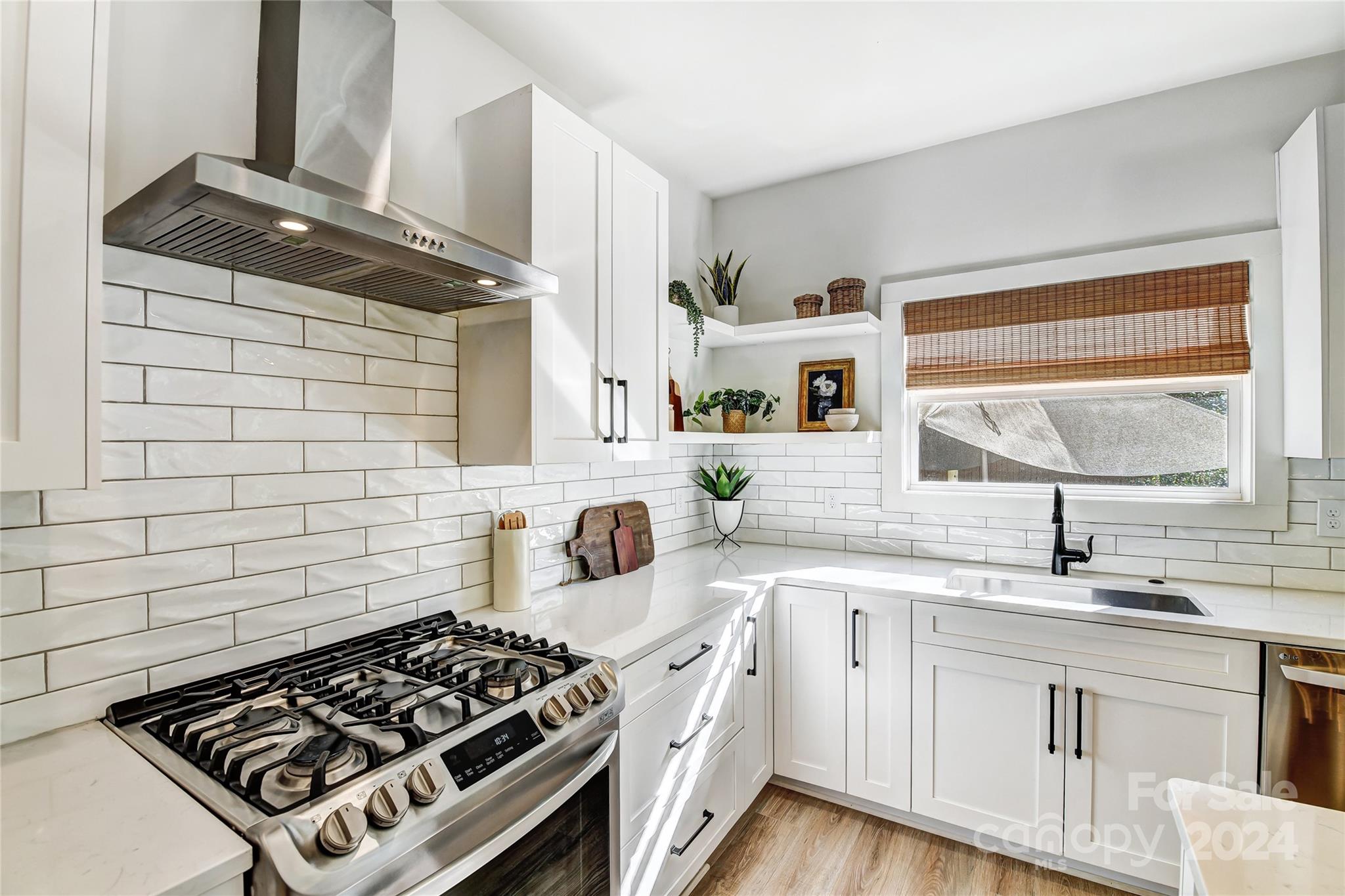 526 Seldon Drive Charlotte, NC 28216 - Photo 14 of 46 a kitchen with a sink a stove and cabinets