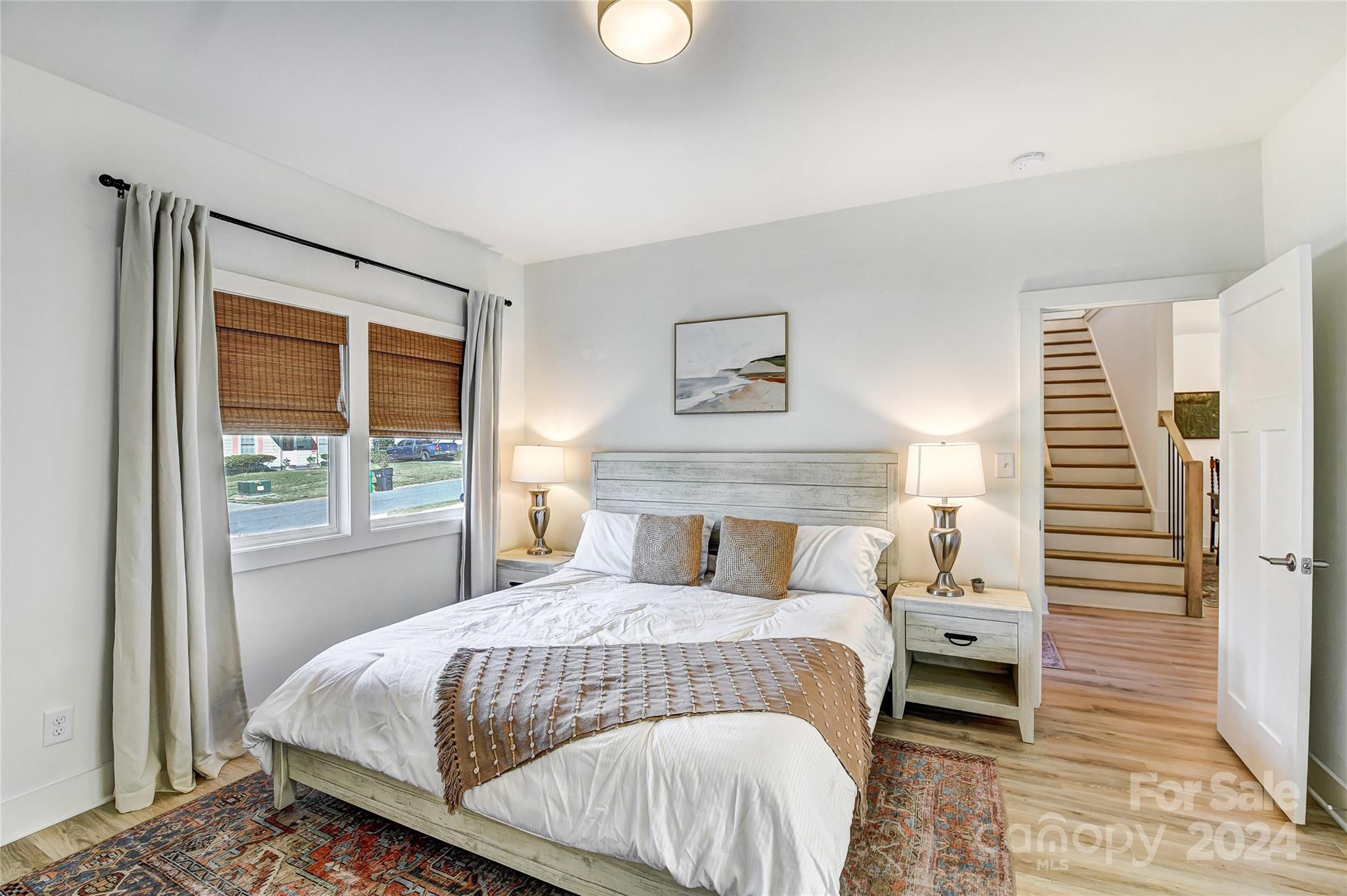 526 Seldon Drive Charlotte, NC 28216 - Photo 19 of 46 a bedroom with a large bed and a window