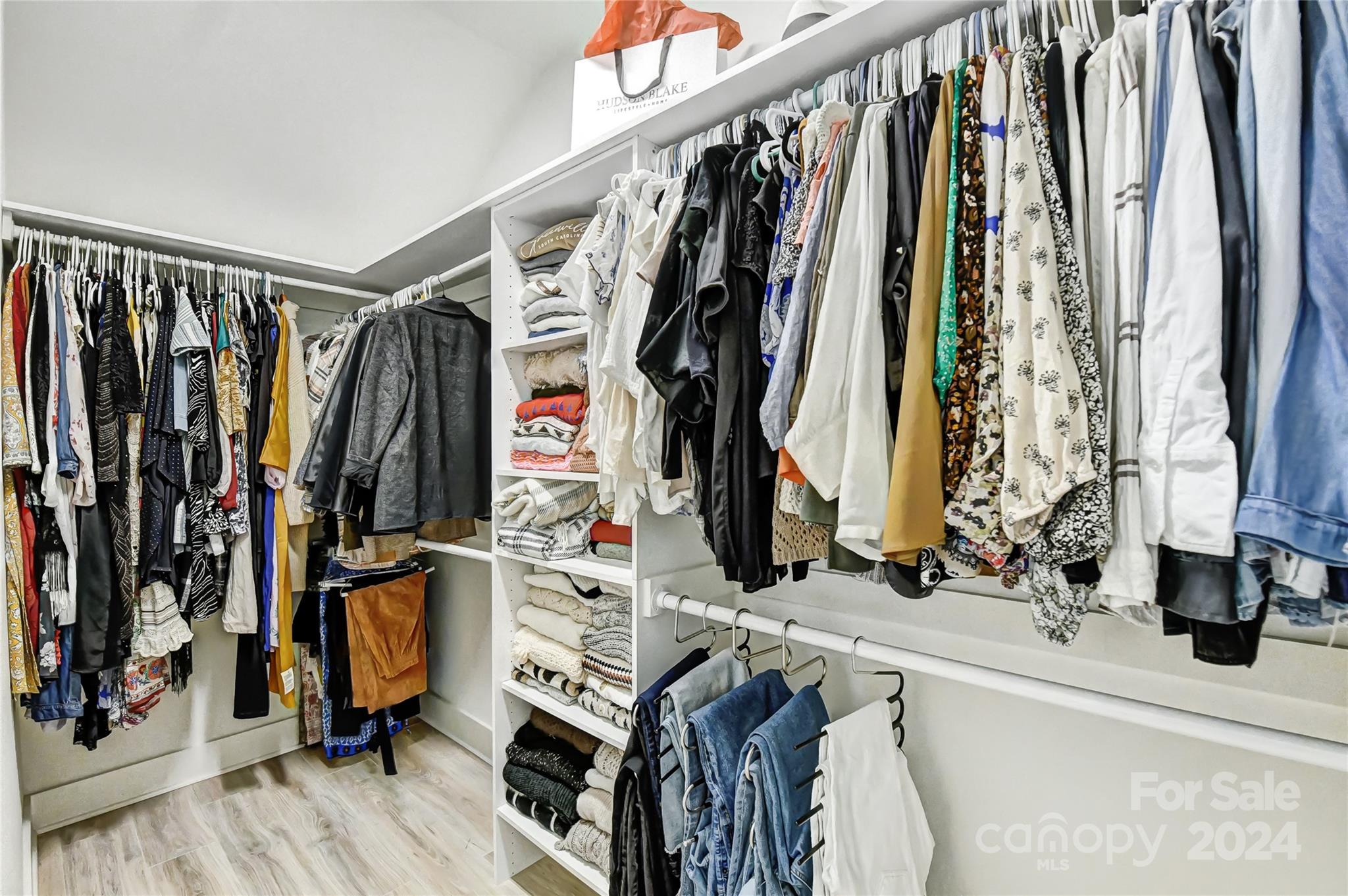 526 Seldon Drive Charlotte, NC 28216 - Photo 23 of 46 a view of walk in closet with clothes and shoes
