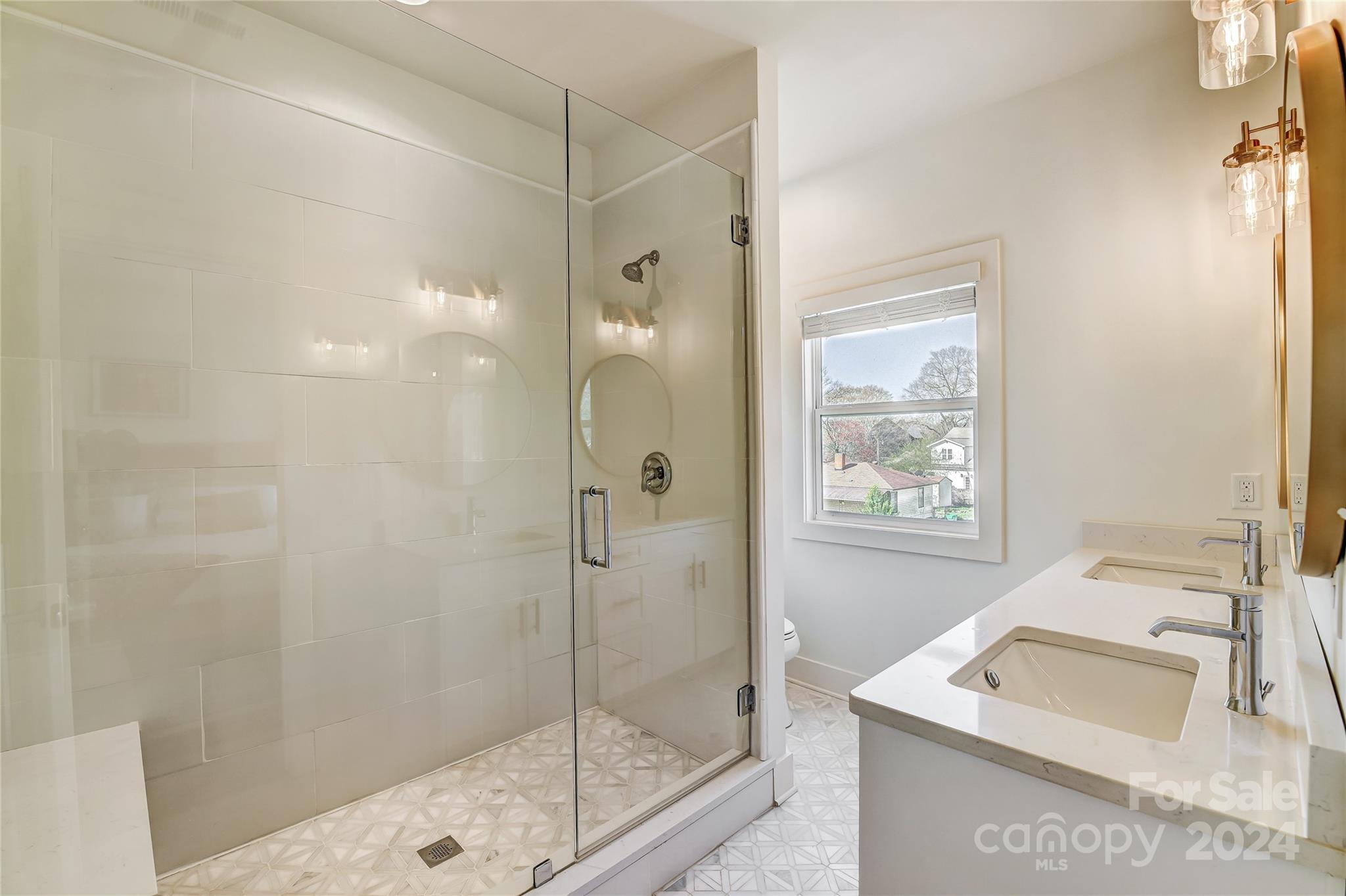 526 Seldon Drive Charlotte, NC 28216 - Photo 32 of 46 a bathroom with a shower sink and mirror