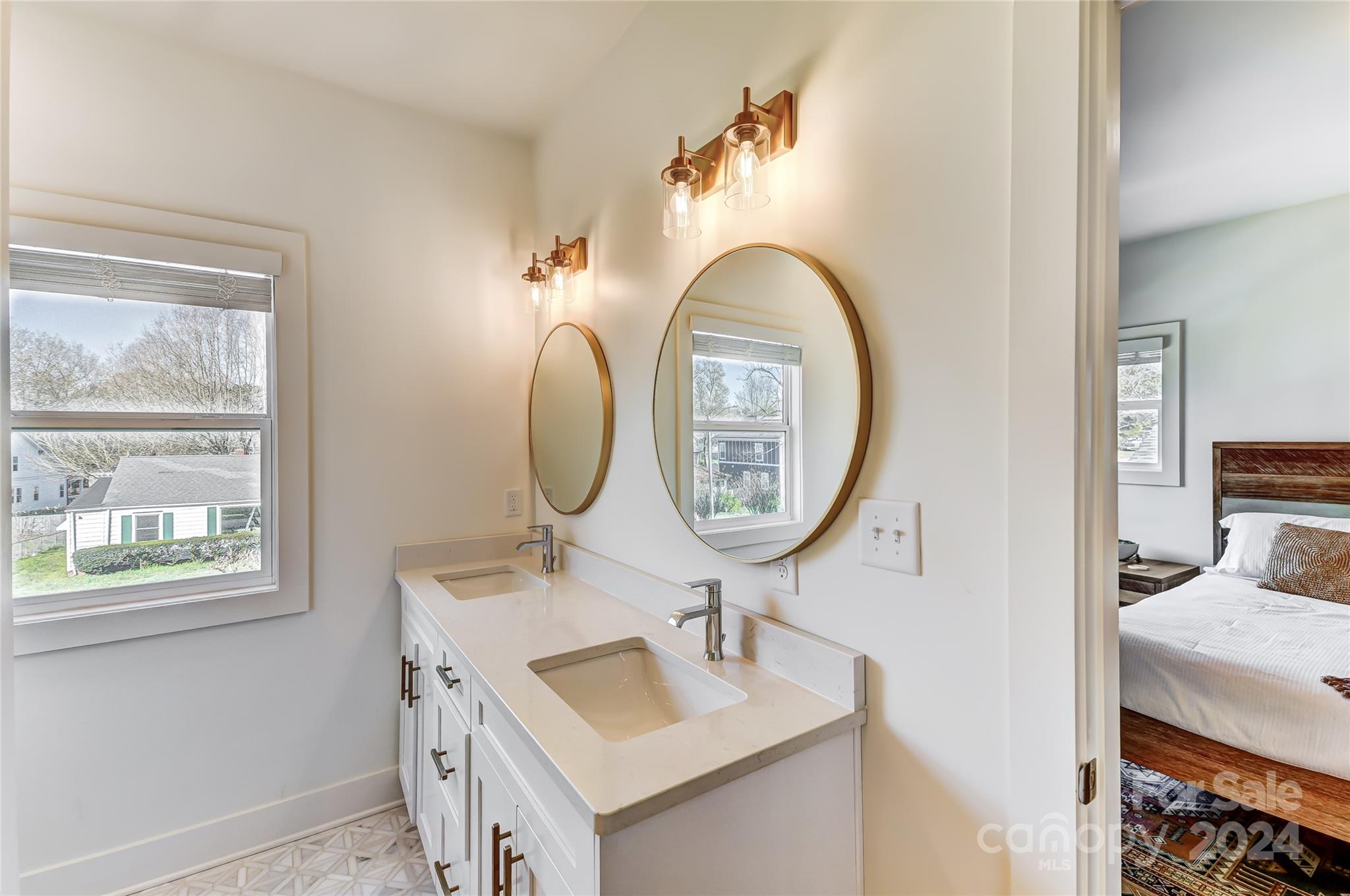 526 Seldon Drive Charlotte, NC 28216 - Photo 33 of 46 a bathroom with a sink and a mirror