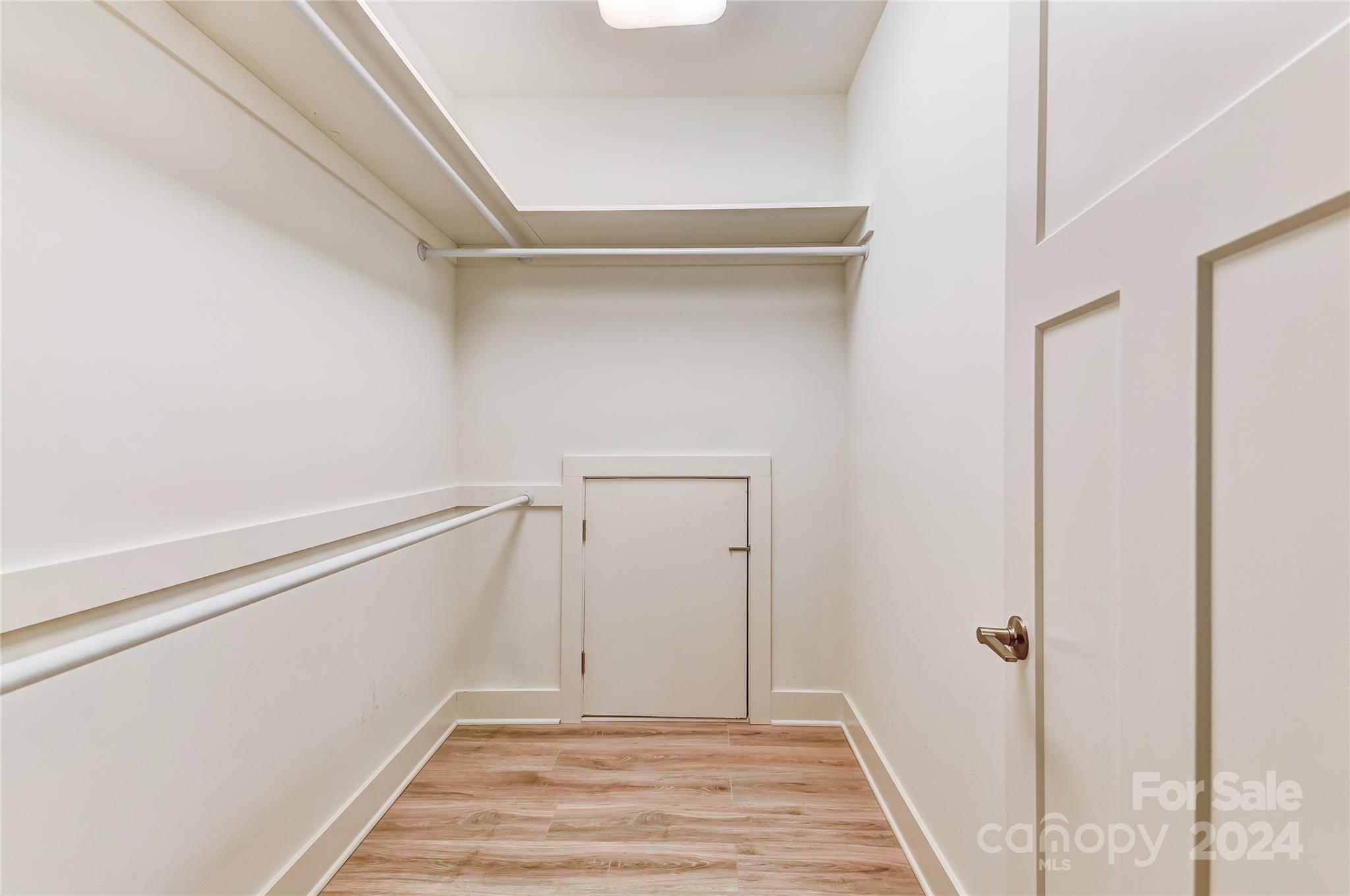 526 Seldon Drive Charlotte, NC 28216 - Photo 34 of 46 a view of a room with wooden floor and white walls