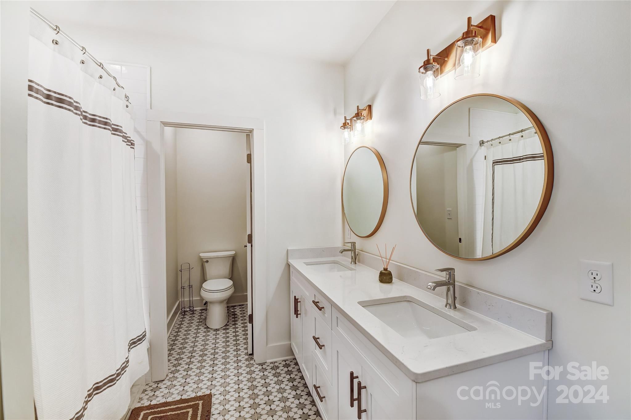 526 Seldon Drive Charlotte, NC 28216 - Photo 36 of 46 a bathroom with a double vanity sink mirror and toilet