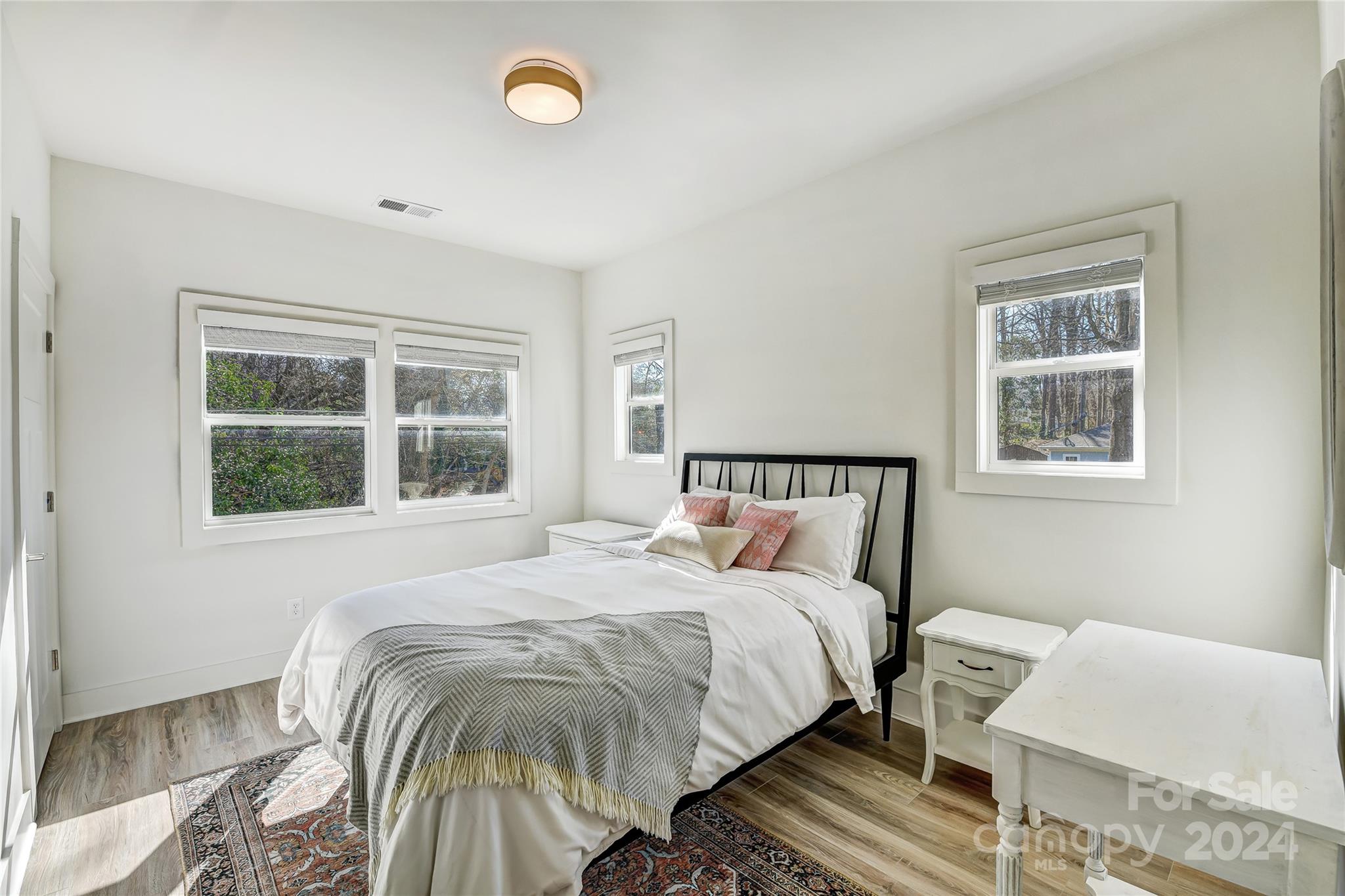 526 Seldon Drive Charlotte, NC 28216 - Photo 37 of 46 a bed sitting in a bedroom next to a window