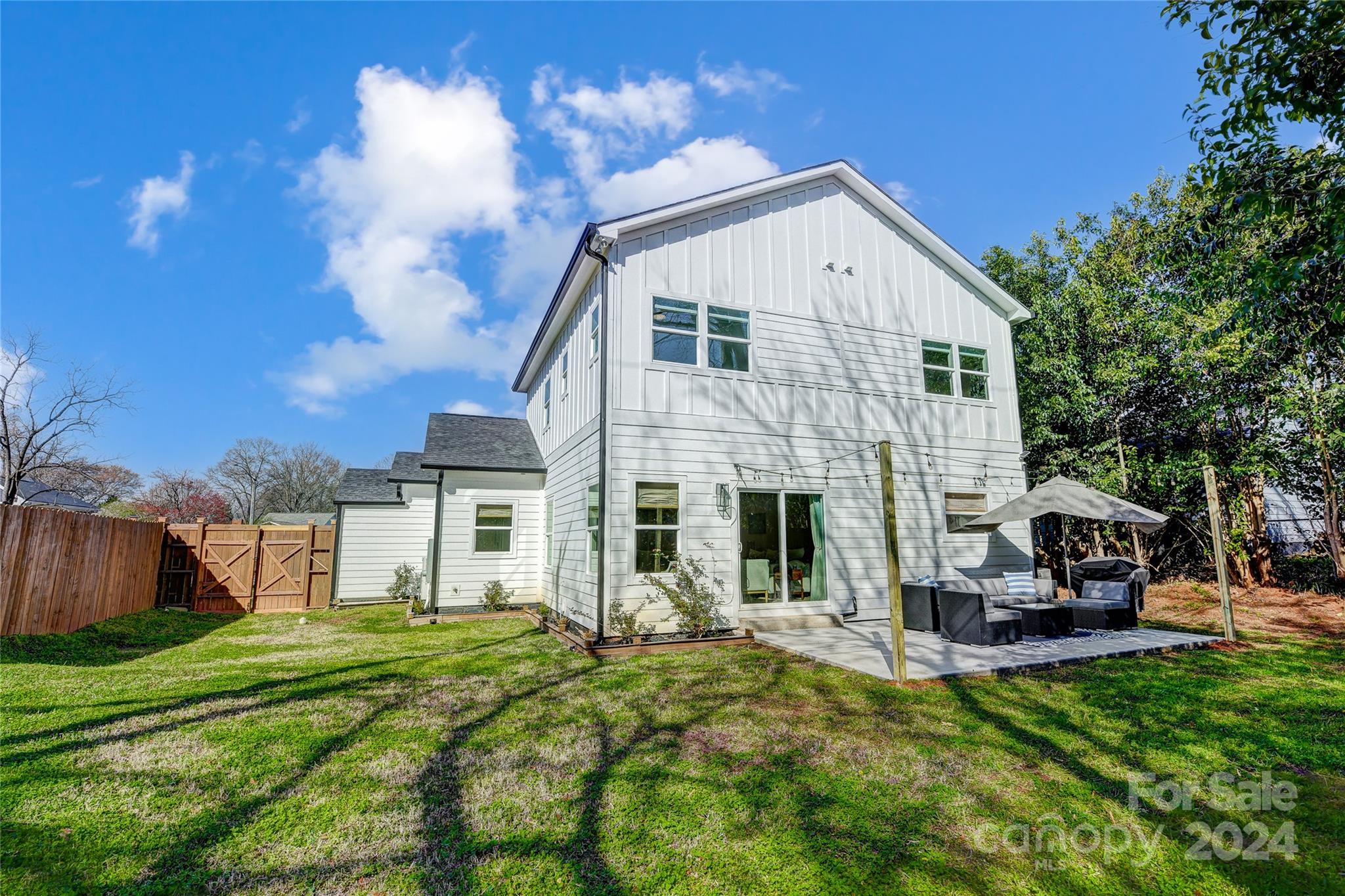 526 Seldon Drive Charlotte, NC 28216 - Photo 44 of 46 a view of a house with a yard patio and fire pit