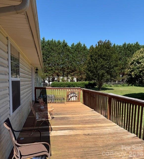 4084 Carpenters Cove Road Claremont, NC 28610 - Photo 20 of 27 a view of balcony with wooden floor and outdoor seating