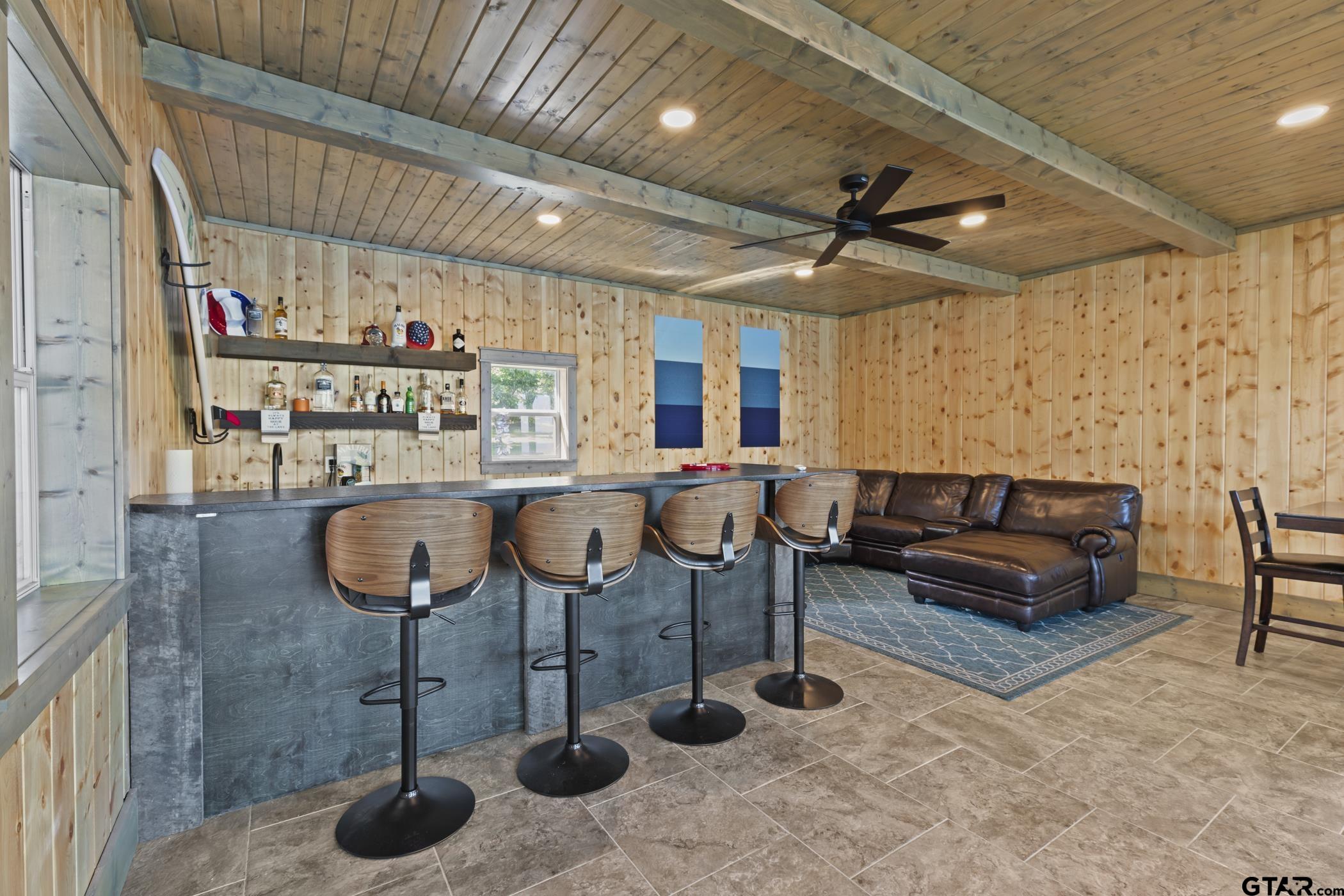 18630 Eastside Road Troup, TX 75789 - Photo 42 of 47 a living room with furniture a flat screen tv and a table