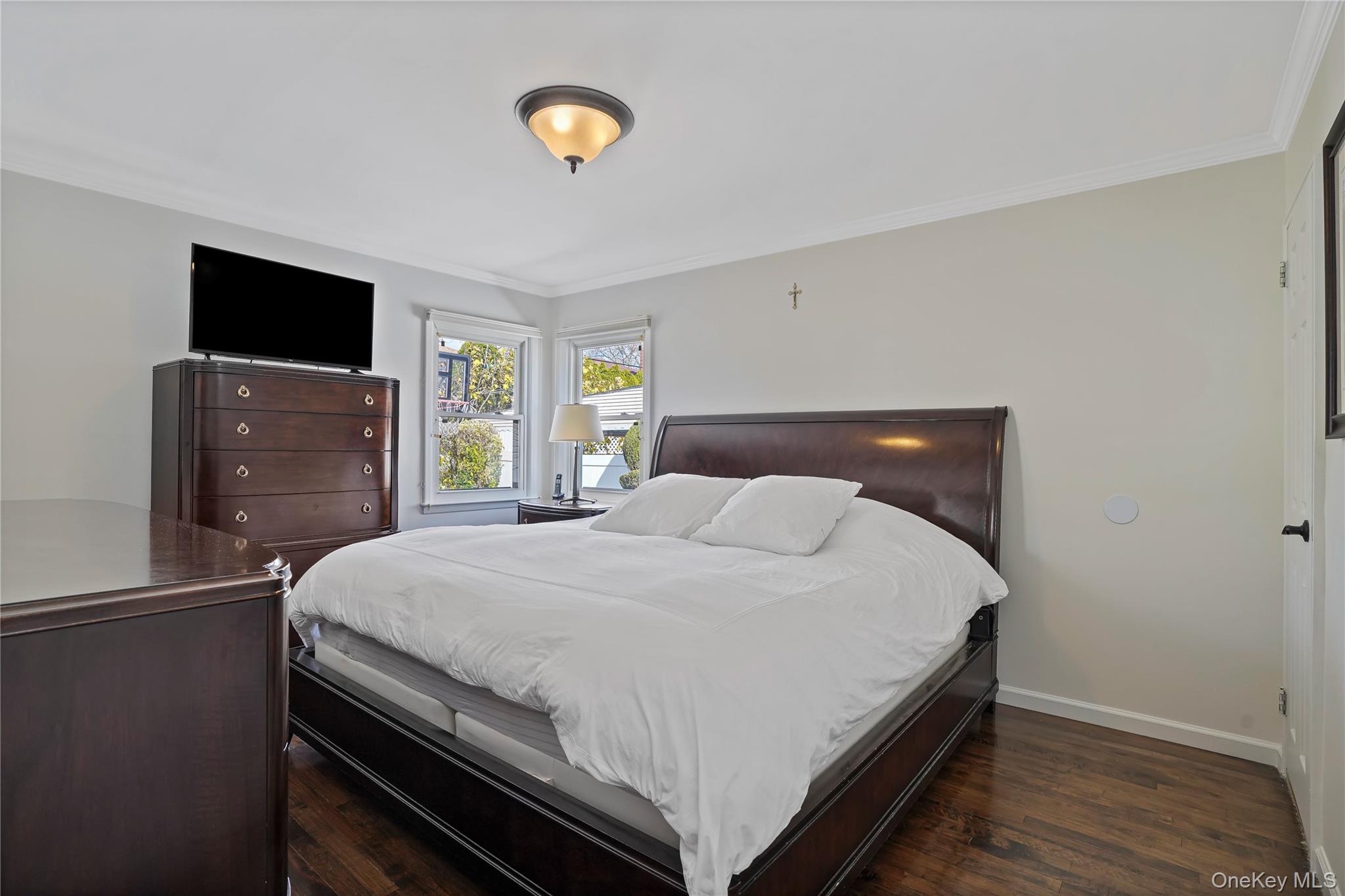 91-03 156th Avenue Queens, NY 11414 - Photo 20 of 50 Bedroom featuring ornamental molding and dark wood-style flooring