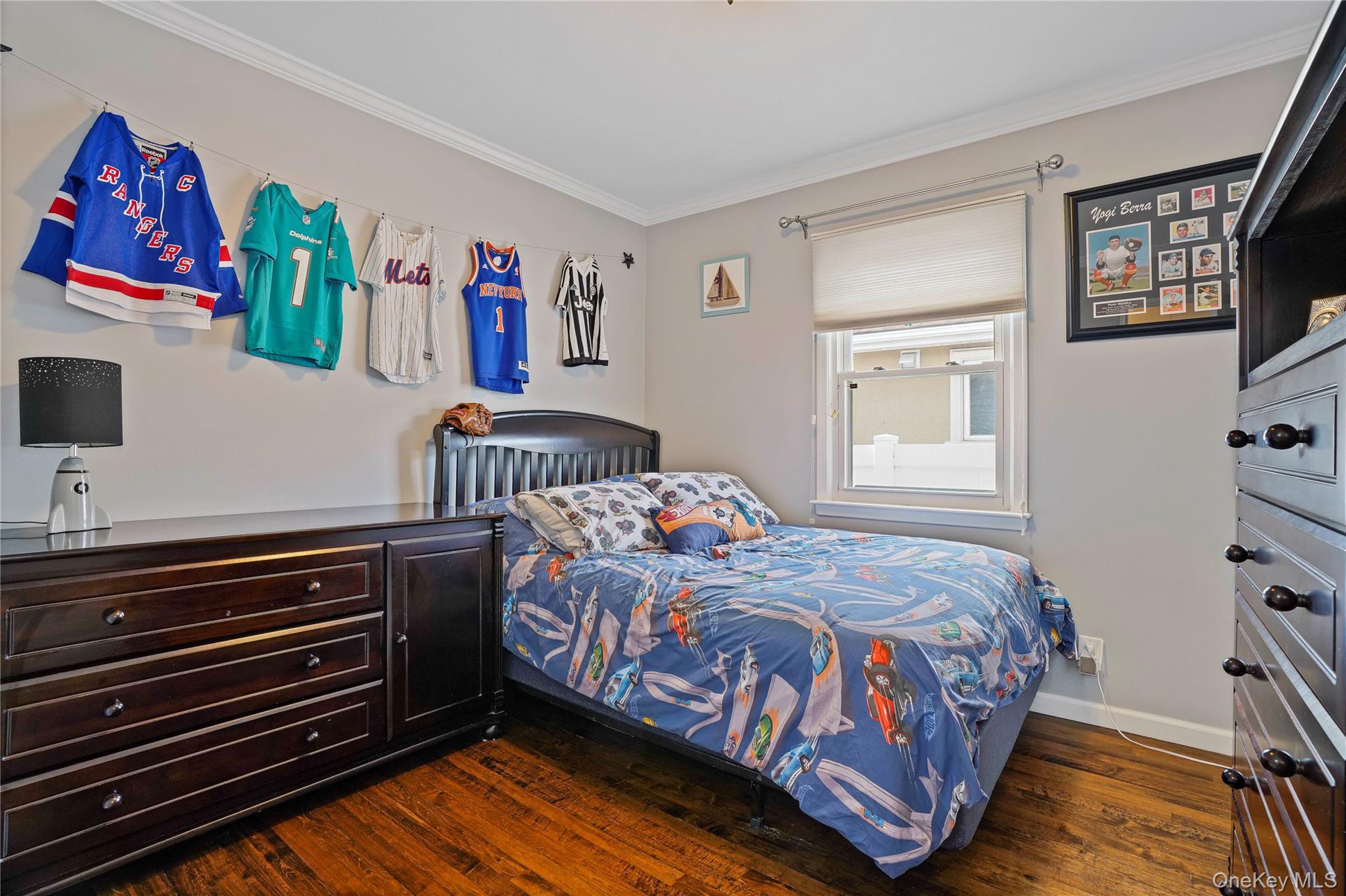 91-03 156th Avenue Queens, NY 11414 - Photo 24 of 50 Bedroom featuring crown molding and dark wood-style flooring