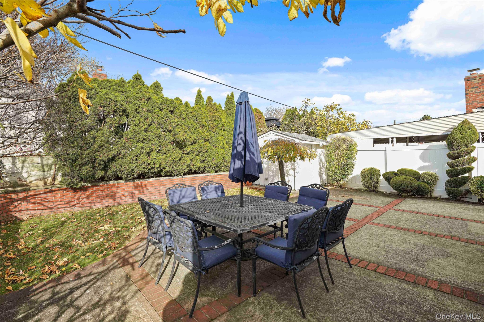 91-03 156th Avenue Queens, NY 11414 - Photo 43 of 50 Fenced backyard featuring outdoor dining space and a patio