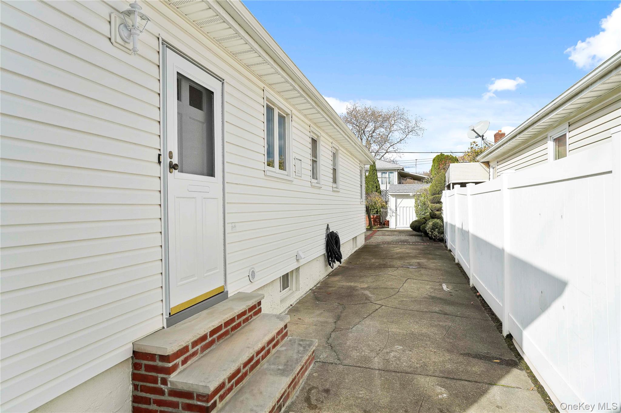 91-03 156th Avenue Queens, NY 11414 - Photo 45 of 50 View of home's exterior featuring entry steps