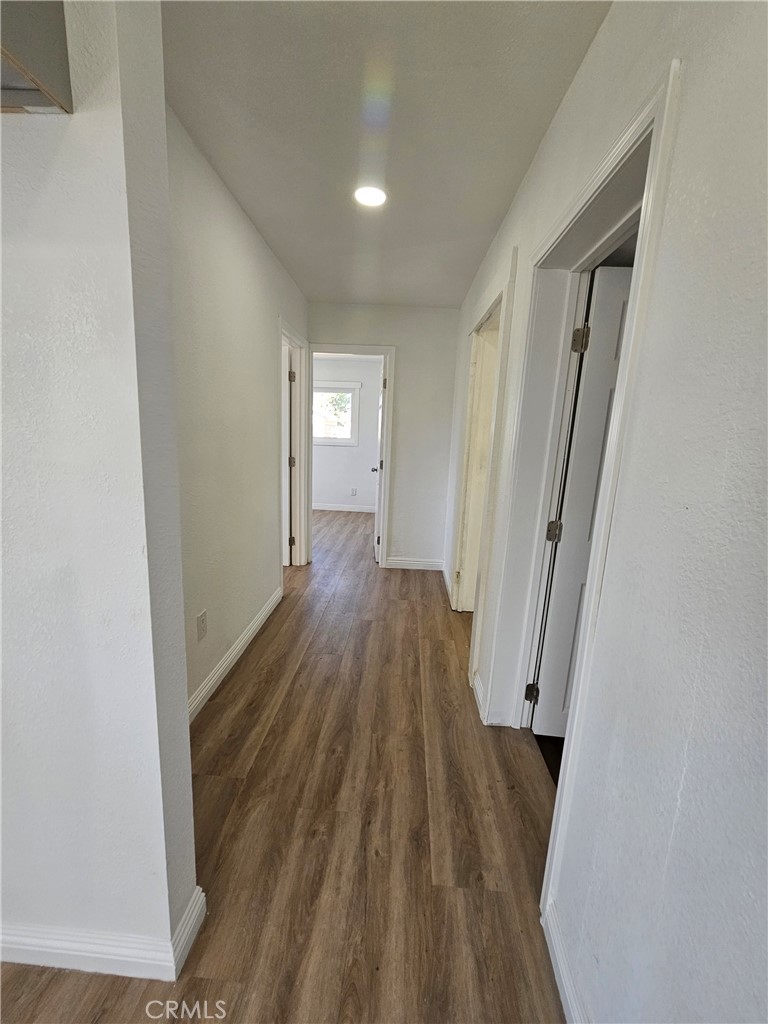 207-207 East O Street Colton, CA 92324 - Photo 12 of 26 a view of a room with wooden floor and staircase
