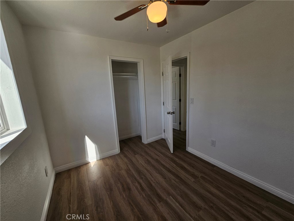207-207 East O Street Colton, CA 92324 - Photo 15 of 26 wooden floor in an empty room with a window