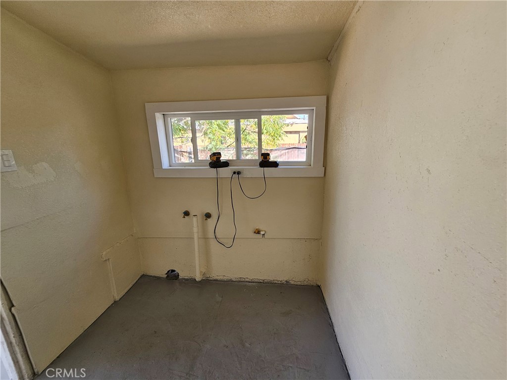 207-207 East O Street Colton, CA 92324 - Photo 18 of 26 a view of a room with rack on the wall and a window