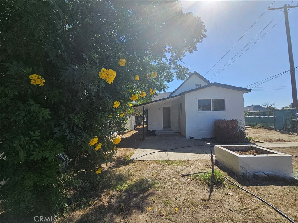 207-207 East O Street Colton, CA 92324 - Photo 20 of 26 a house view with a sitting space fire pit and outdoor space