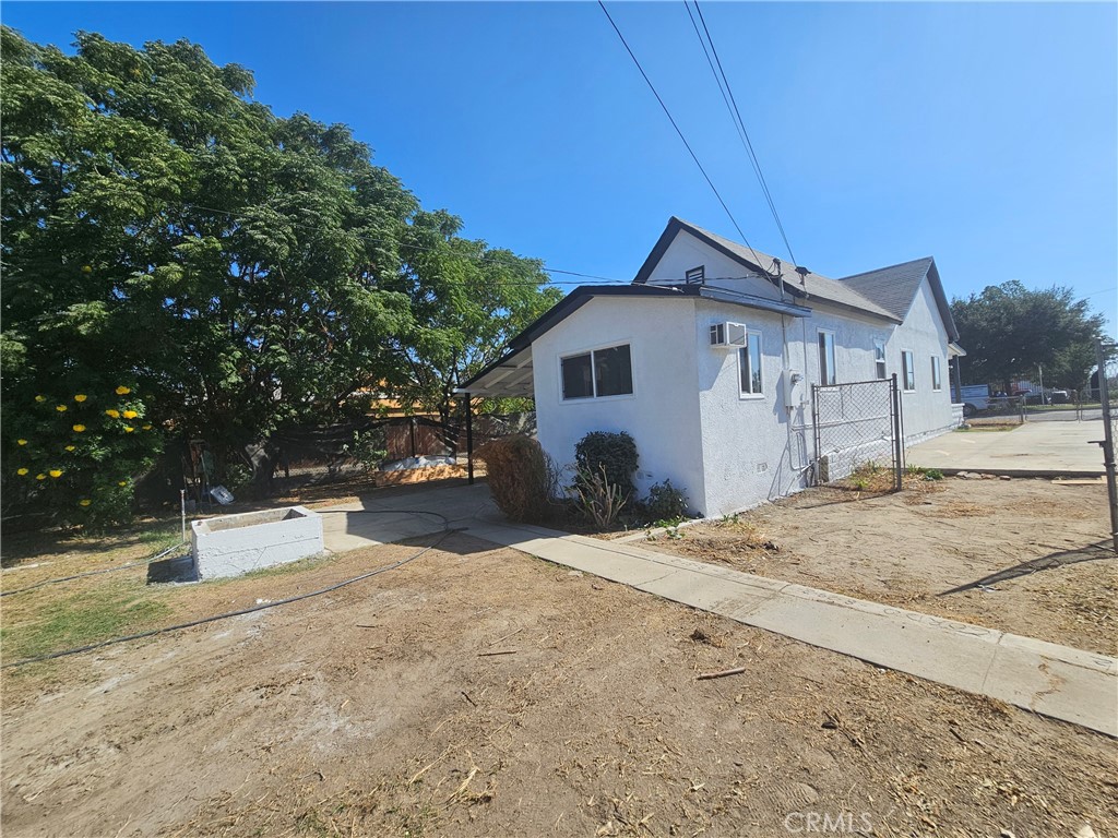207-207 East O Street Colton, CA 92324 - Photo 21 of 26 a view of a house with a yard