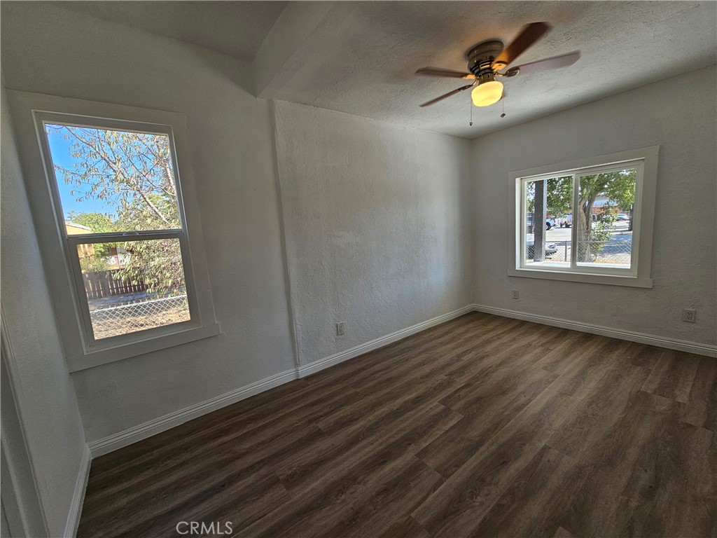 207-207 East O Street Colton, CA 92324 - Photo 8 of 26 a view of an empty room and window and wooden floor