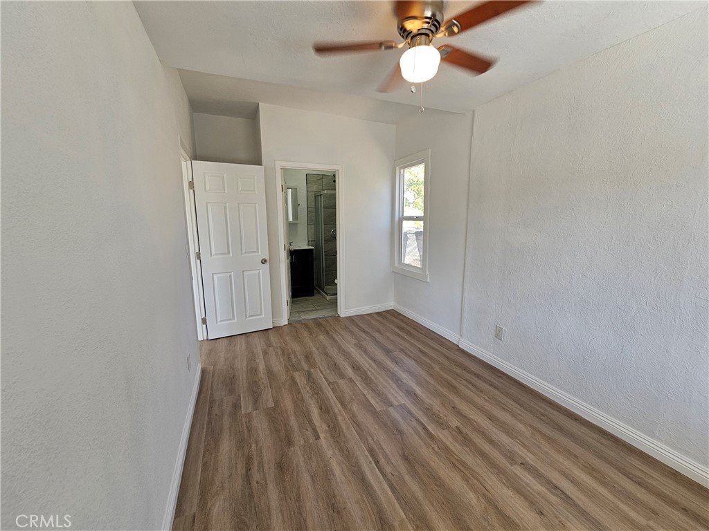 207-207 East O Street Colton, CA 92324 - Photo 9 of 26 wooden floor in an empty room with a window