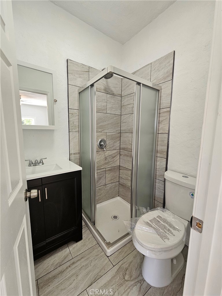 207-207 East O Street Colton, CA 92324 - Photo 10 of 26 a bathroom with a sink a toilet and shower