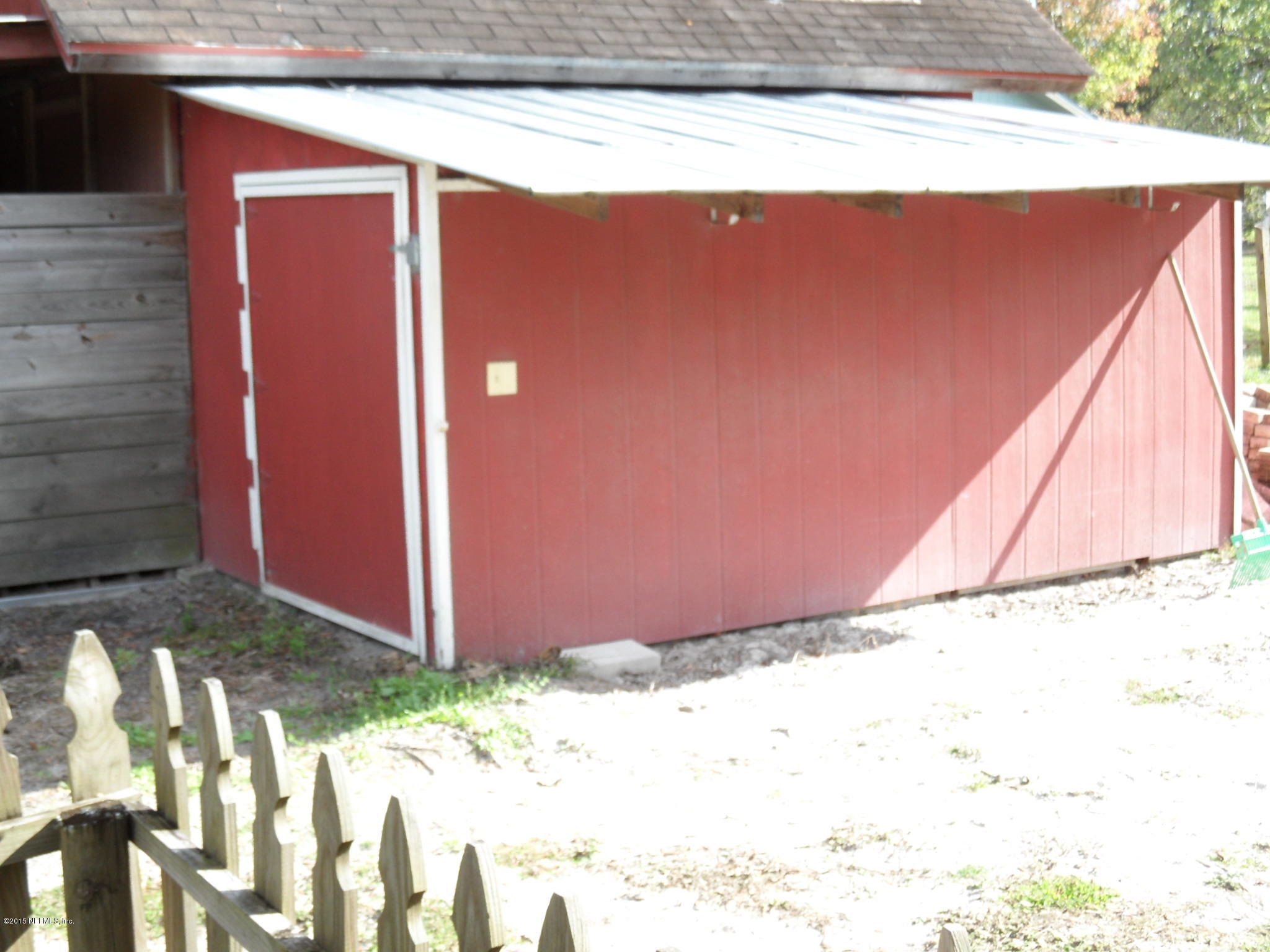 2873 Eagle Point Road Middleburg, FL 32068 - Photo 39 of 50 Lawn storage attached to tack room