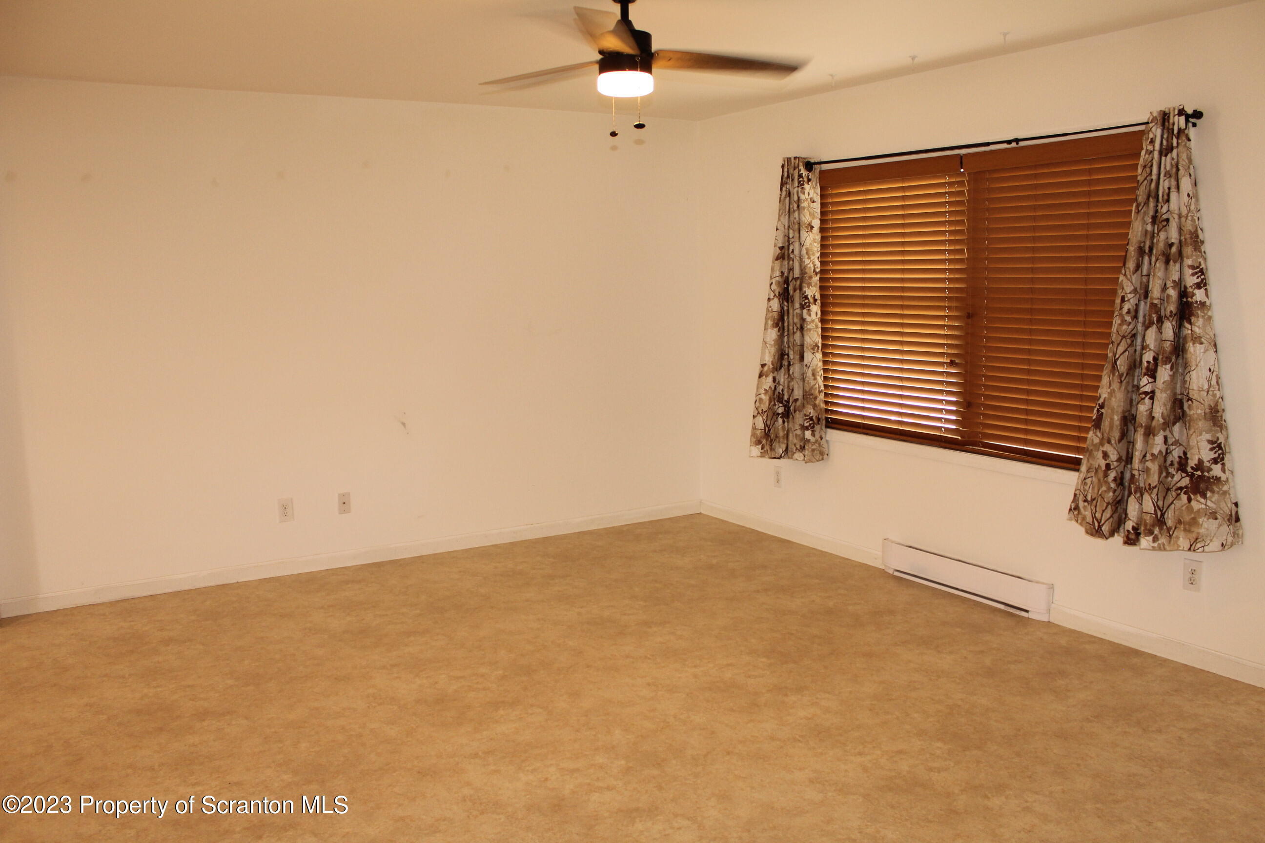 23 Delany Drive Tunkhannock, PA 18657 - Photo 2 of 8 an empty room with windows