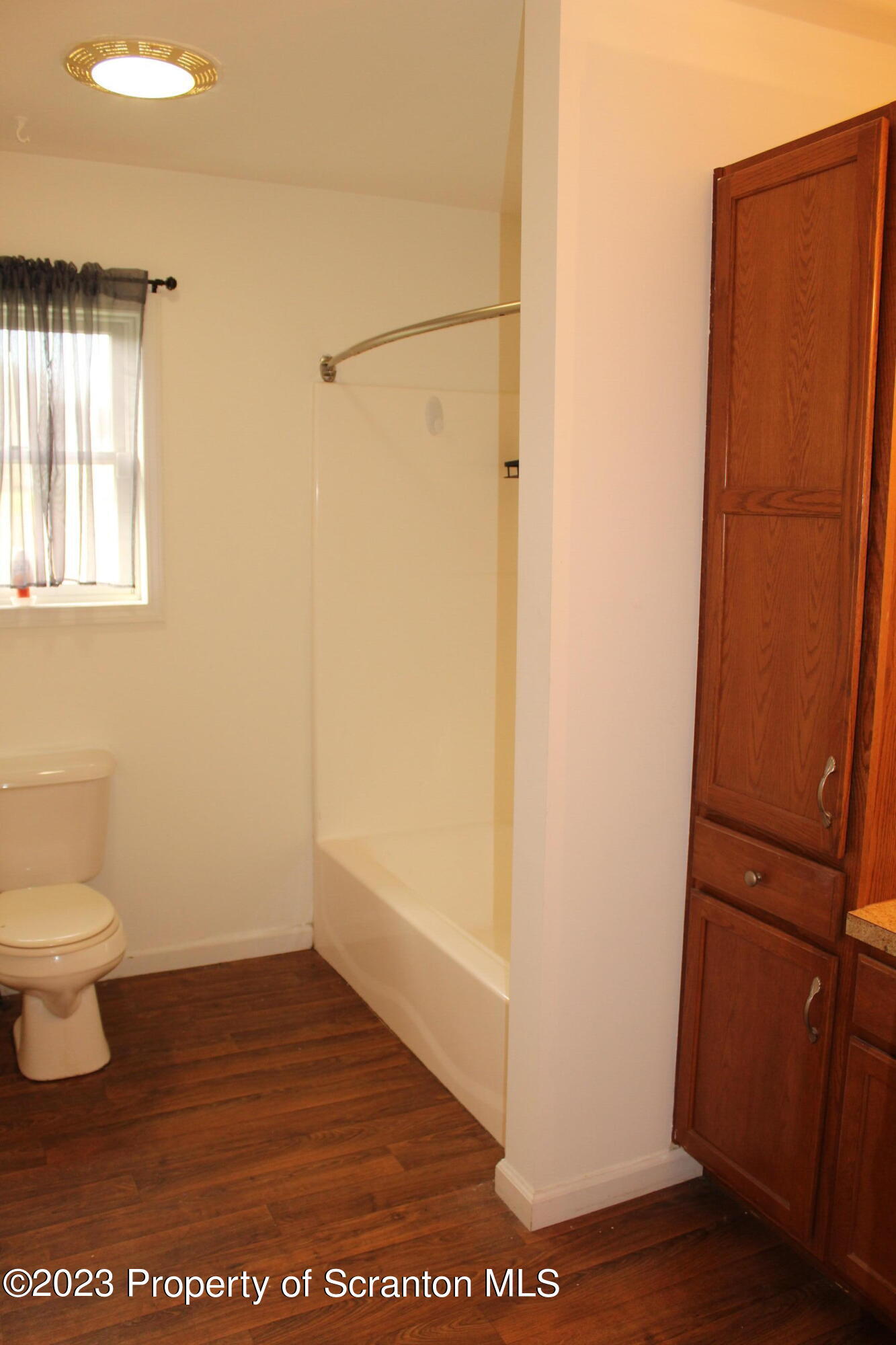 23 Delany Drive Tunkhannock, PA 18657 - Photo 5 of 8 a bathroom with a toilet a sink and a shower