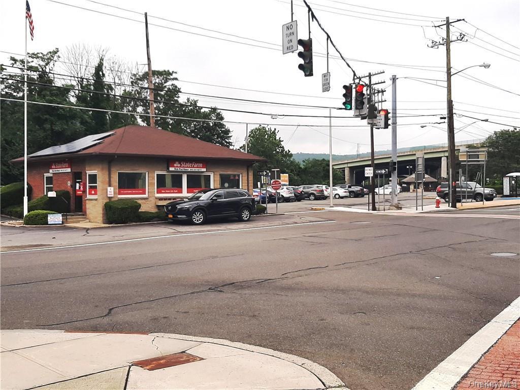 18 Pavilion Ridge Way, Unit 1 Suffern, NY 10901 - Photo 13 of 15 a car parked in front of building on the road