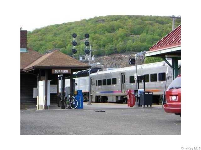 18 Pavilion Ridge Way, Unit 1 Suffern, NY 10901 - Photo 15 of 15 a aerial view of a house with a garden and plants