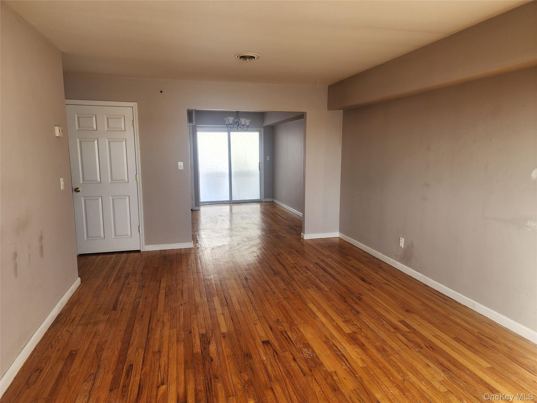 18 Pavilion Ridge Way, Unit 1 Suffern, NY 10901 - Photo 7 of 15 a view of an empty room with wooden floor and closet