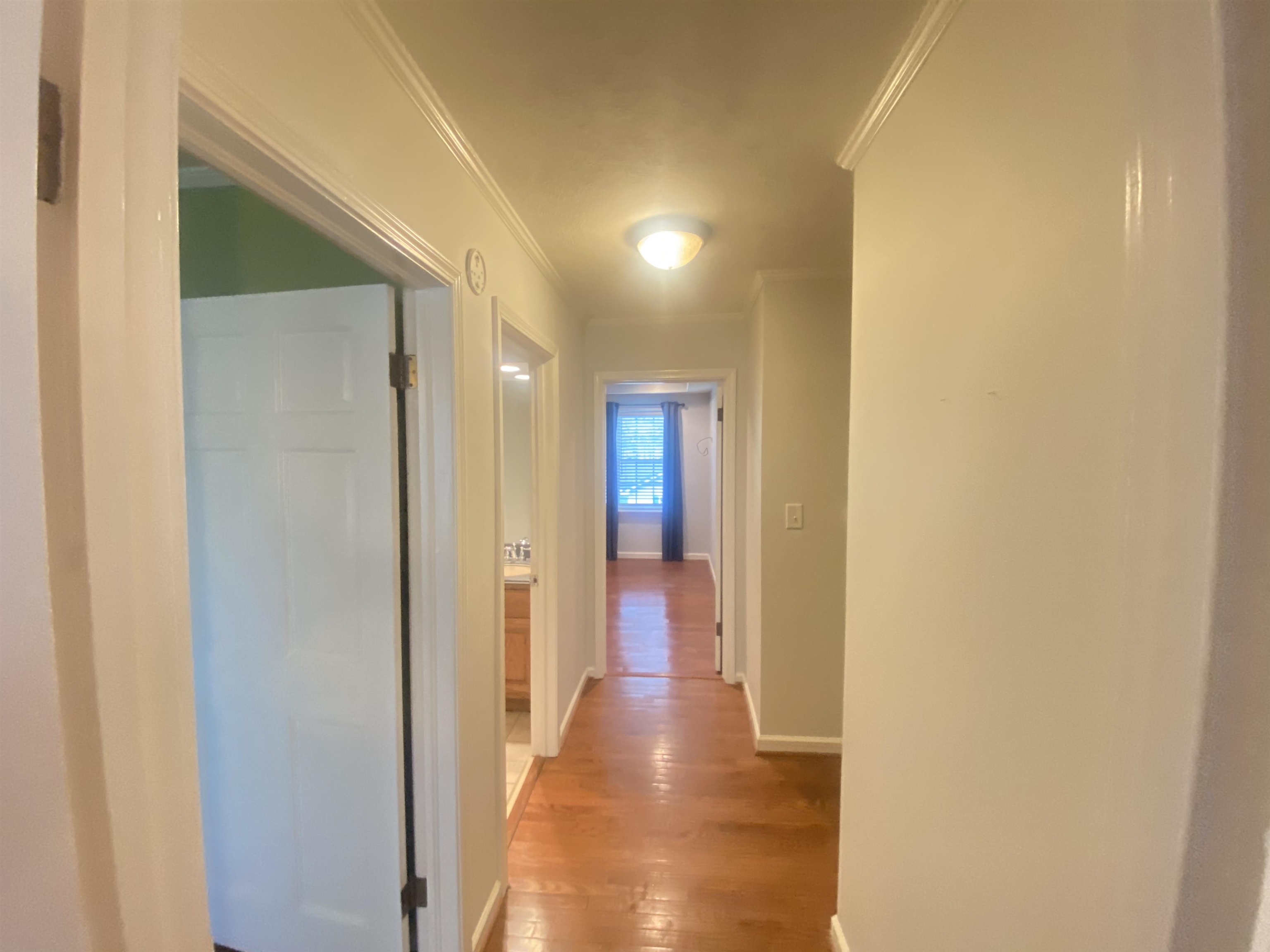 629 Hillside Drive Adamsville, TN 38310 - Photo 10 of 35 a view of a hallway with wooden floor