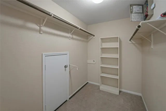 a view of an empty walk in closet