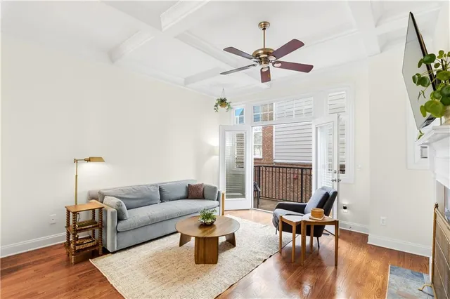 a living room with furniture fireplace and flat screen tv