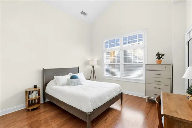 a bathroom with a double vanity sink mirror and shower