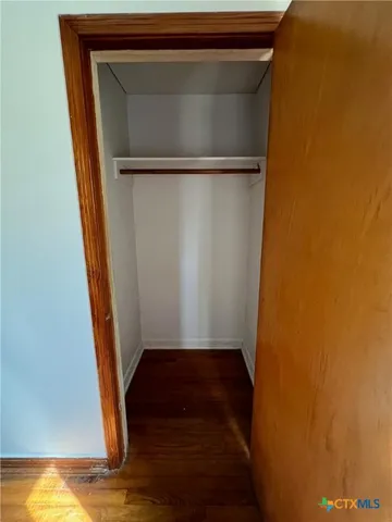 a view of a kitchen with a sink and dishwasher wooden floor