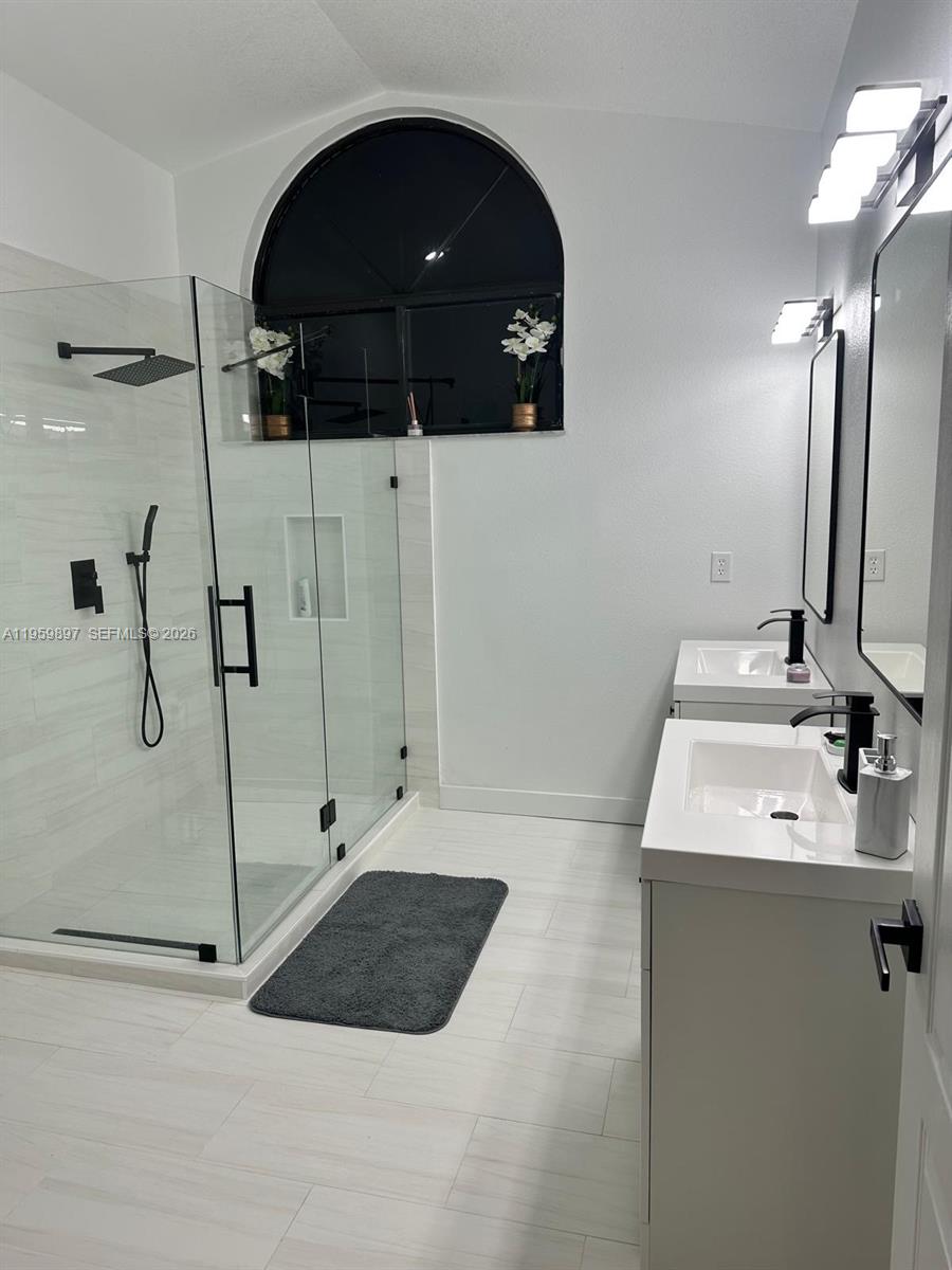 2359 Kings Crest Road Kissimmee, FL 34744 - Photo 12 of 18 a bathroom with a sink and mirror