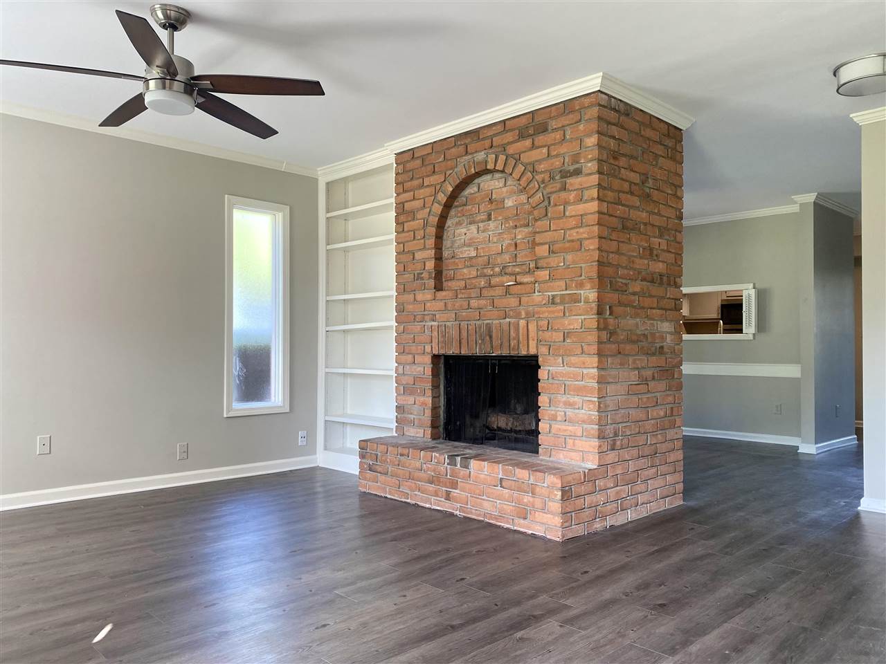214 South Walnut Bend Road Memphis, TN 38018 - Photo 2 of 24 Den features cozy fireplace with built in bookcase.