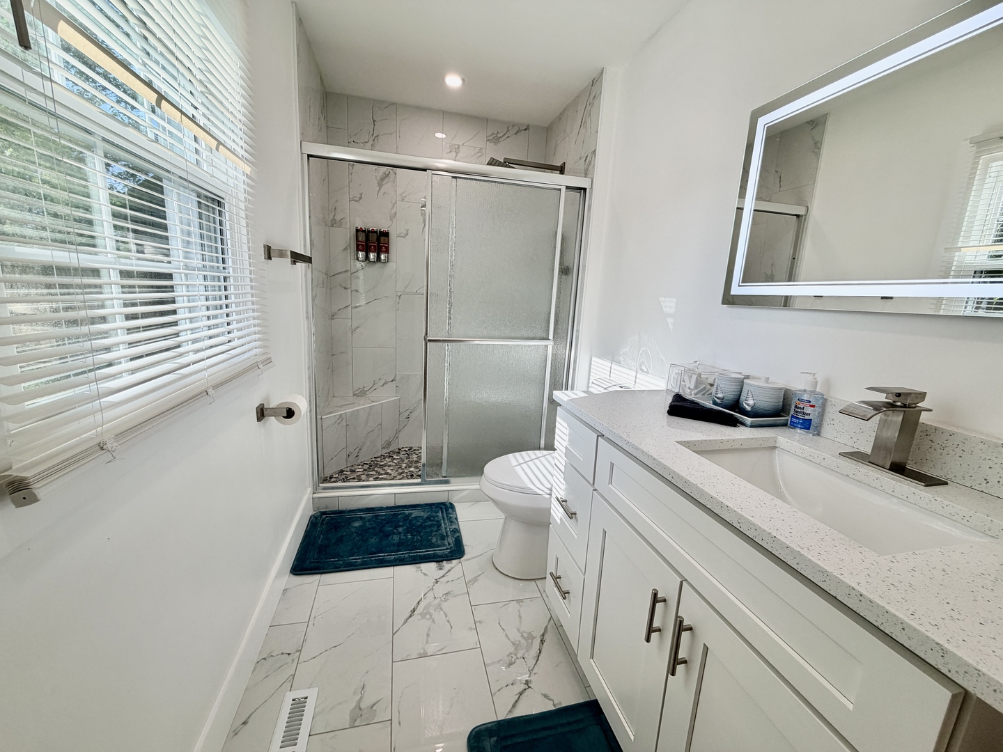 1112 Ophia Street Metropolis, IL 62960 - Photo 20 of 32 a bathroom with a sink a toilet and shower