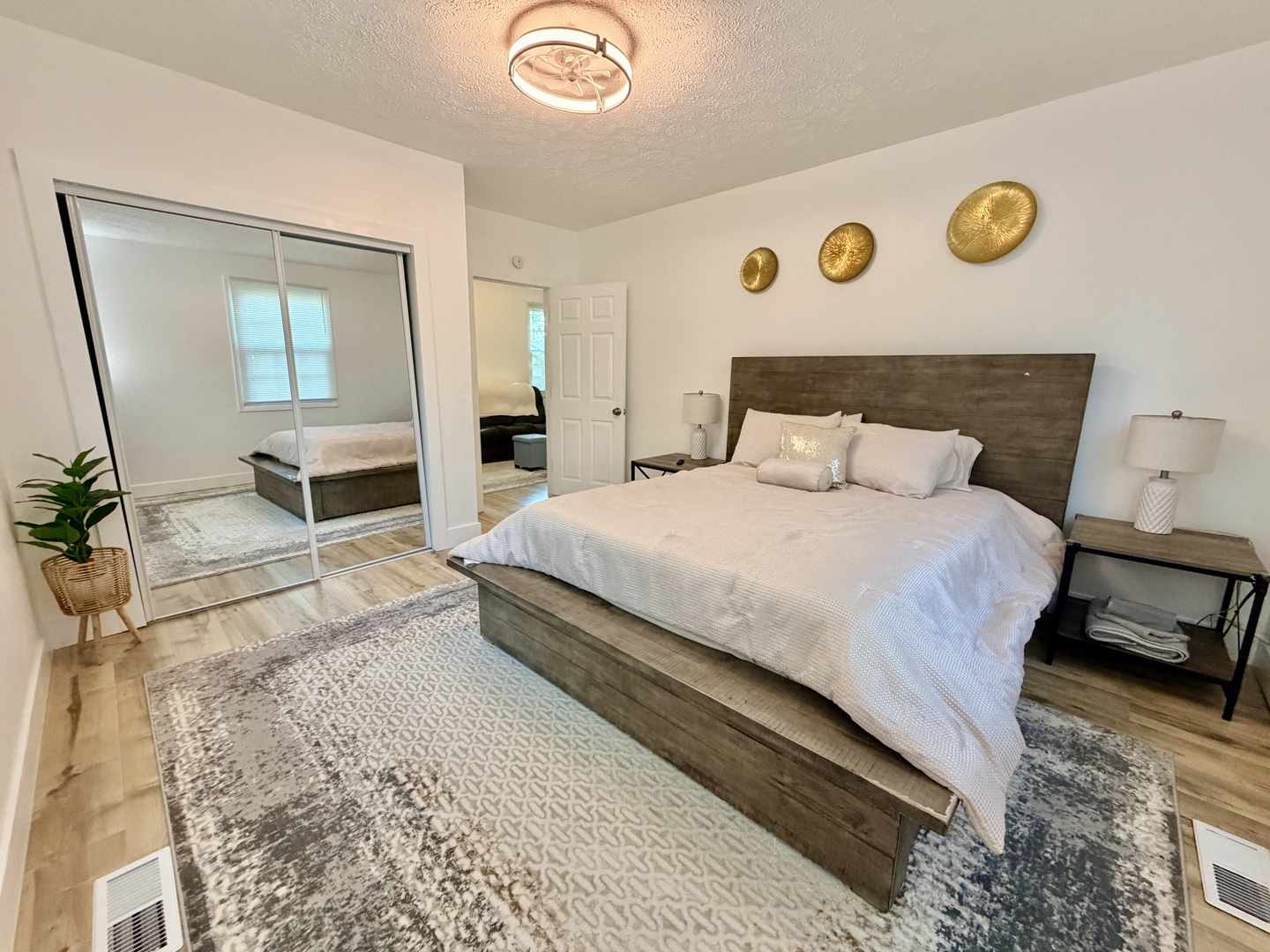1112 Ophia Street Metropolis, IL 62960 - Photo 24 of 32 a bedroom with a bed and dresser with mirror