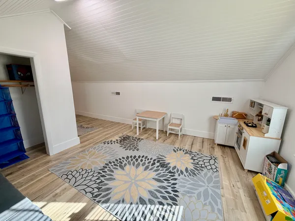 a living room with a couch and a rug