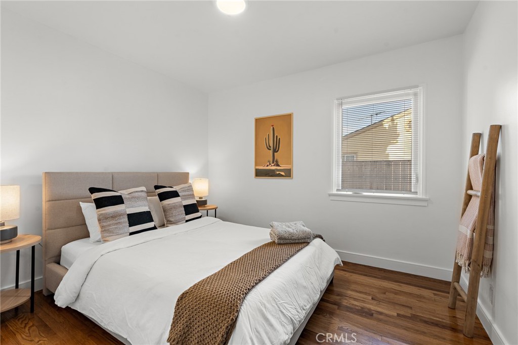 5027 West 135th Street Hawthorne, CA 90250 - Photo 14 of 24 a bedroom with a bed and a window