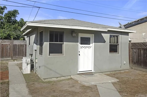 a view of house with backyard