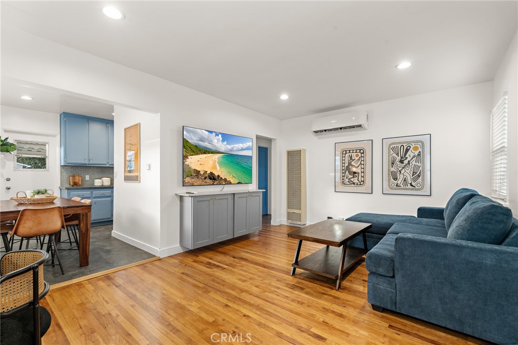 5027 West 135th Street Hawthorne, CA 90250 - Photo 3 of 24 a living room with furniture and a wooden floor
