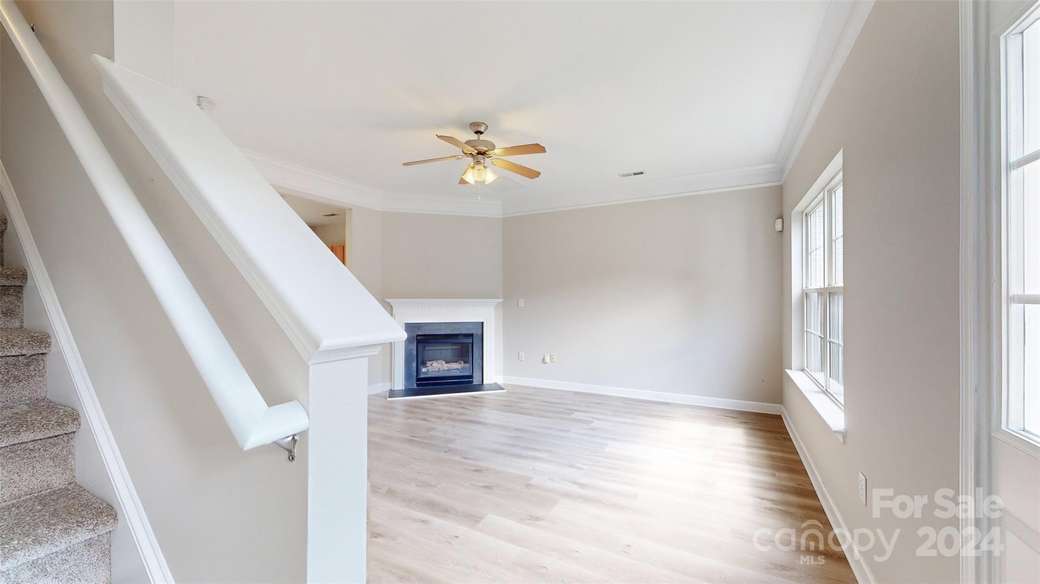 704 Raindrops Road Gastonia, NC 28054 - Photo 3 of 32 a view of an empty room with a fireplace