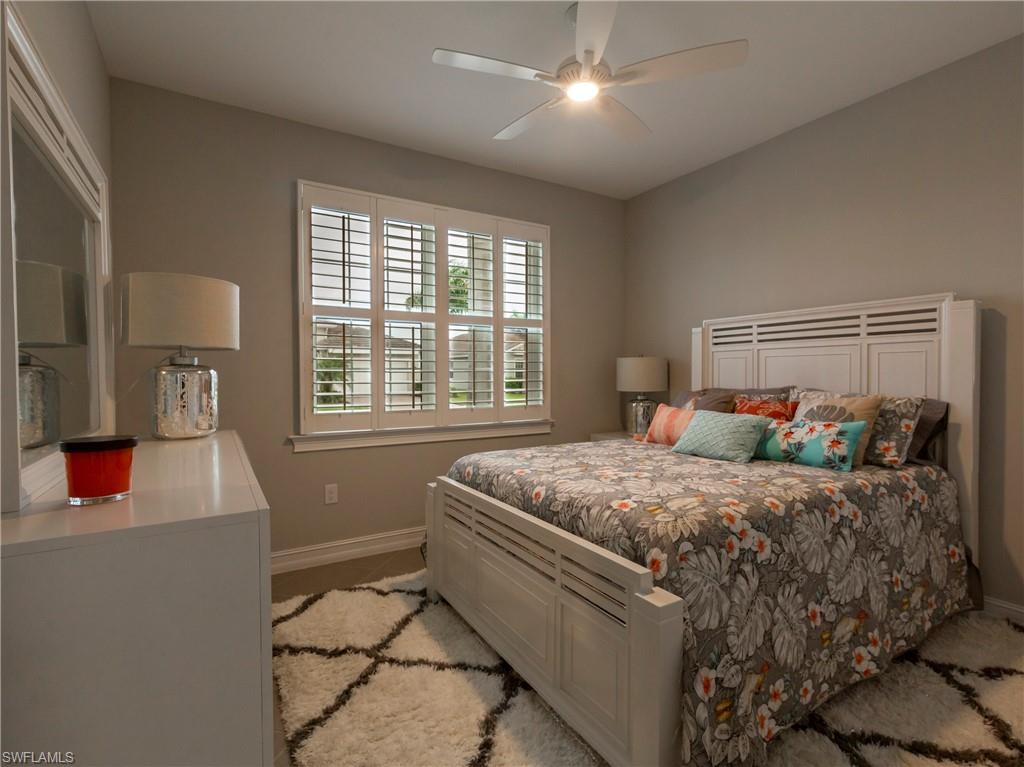 14671 Topsail Drive Naples, FL 34114 - Photo 11 of 26 a bedroom with a bed and window