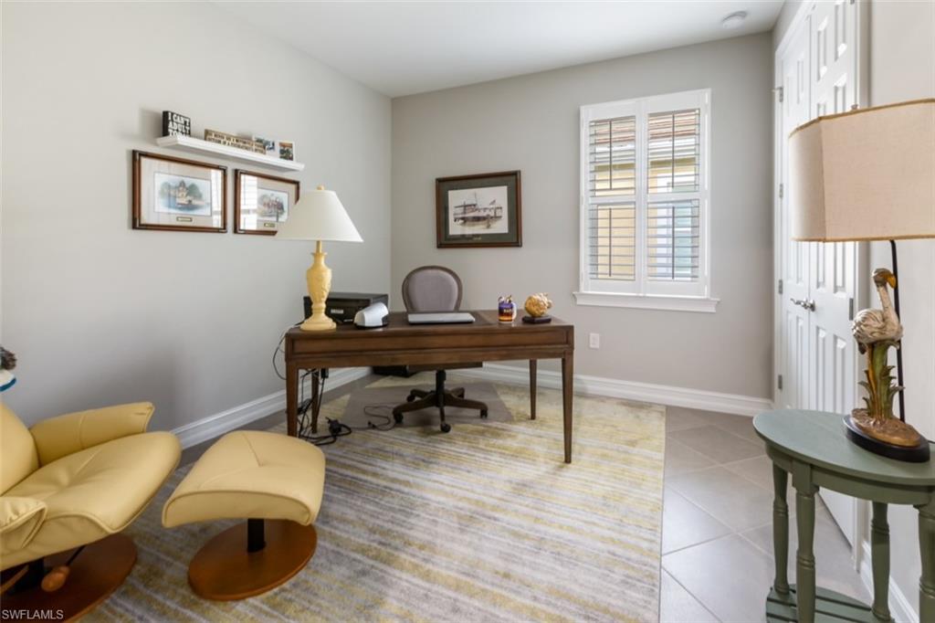 14671 Topsail Drive Naples, FL 34114 - Photo 13 of 26 a living room with furniture and a window