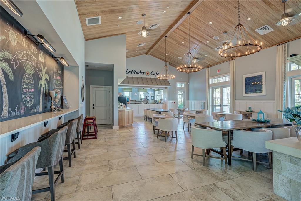 14671 Topsail Drive Naples, FL 34114 - Photo 26 of 26 a view of a dining room with furniture