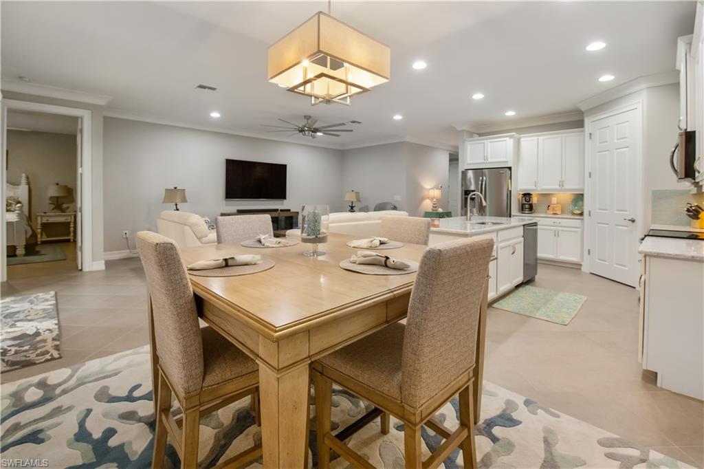 14671 Topsail Drive Naples, FL 34114 - Photo 6 of 26 a view of a dining room with furniture
