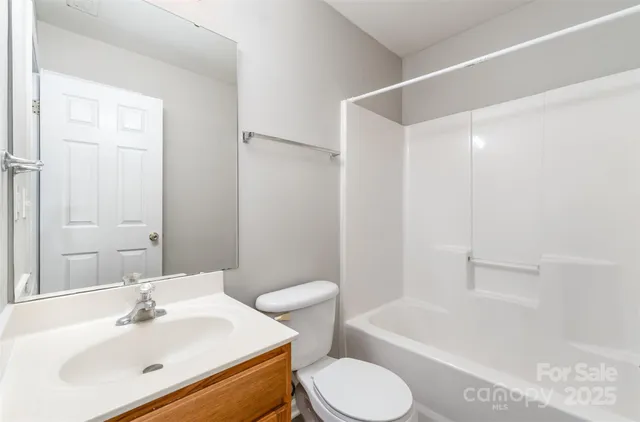 a bathroom with a sink toilet and bathtub