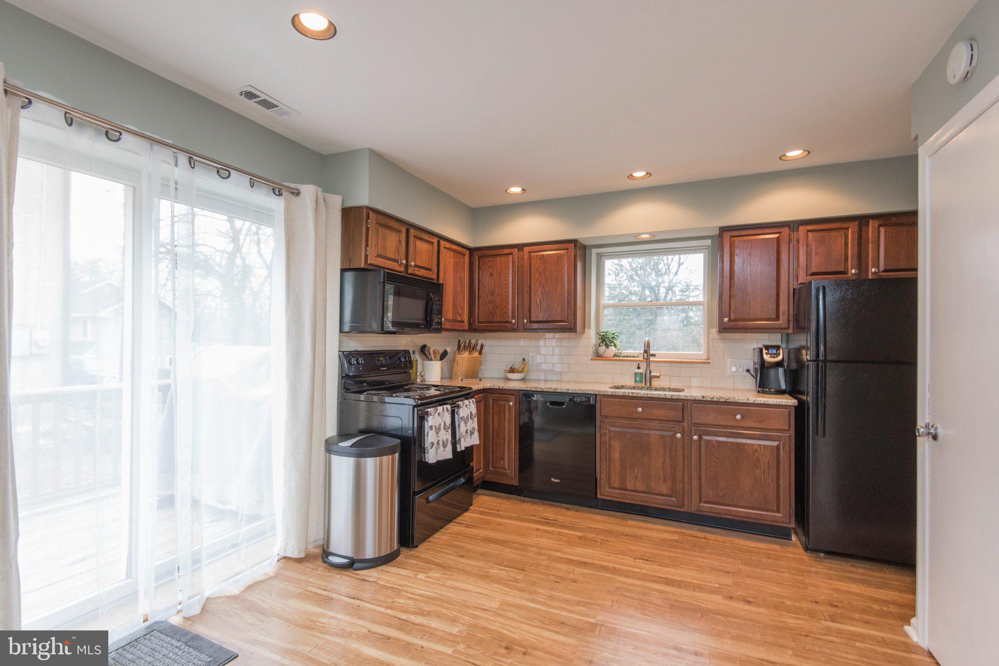 650 North Valley Forge Road Devon, PA 19333 - Photo 13 of 38 Modern kitchen with warm wood tones.